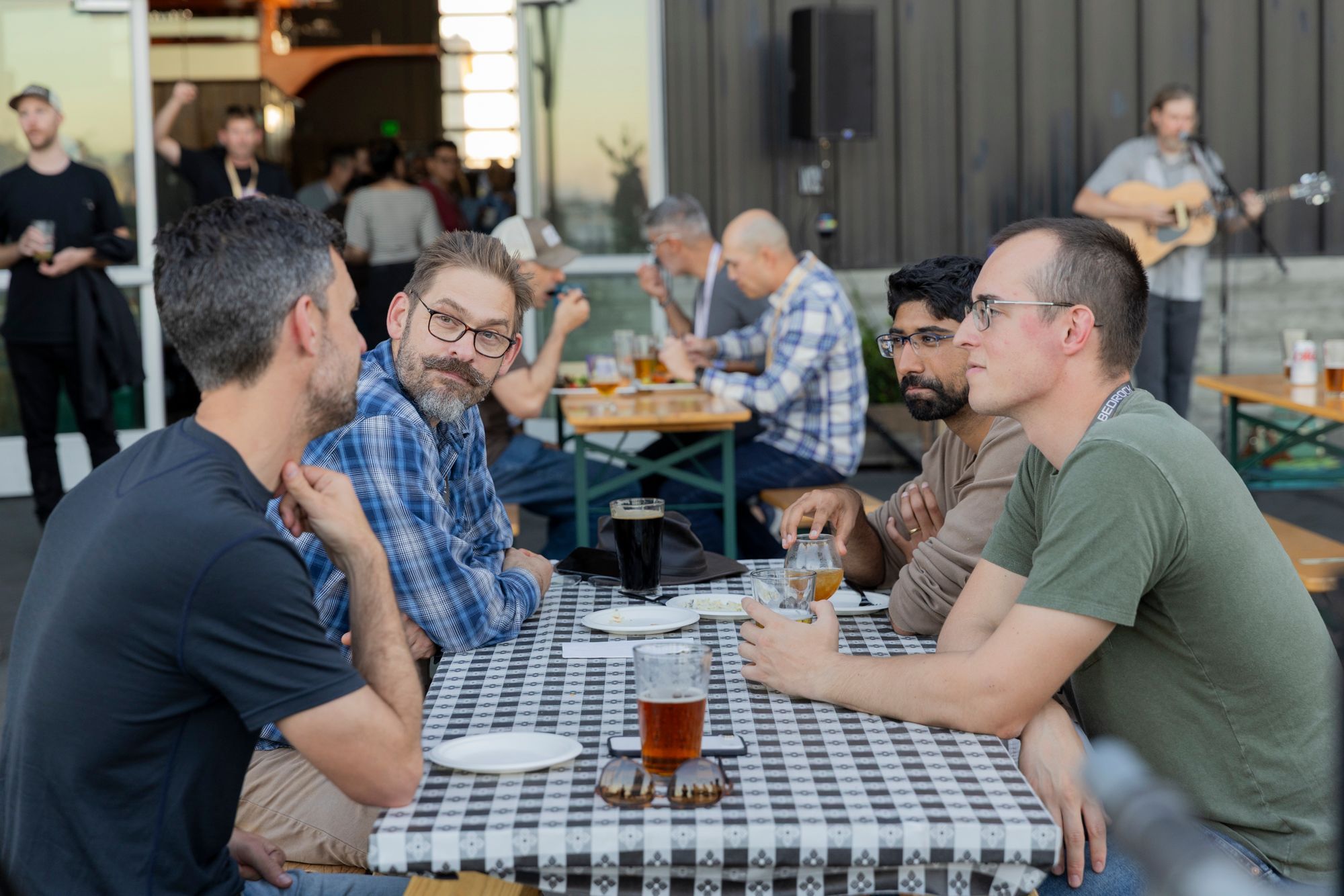 Bedrock teammates talking at an outdoor table